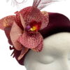 Burgundy Halo crown with orchid flower & feather detail.